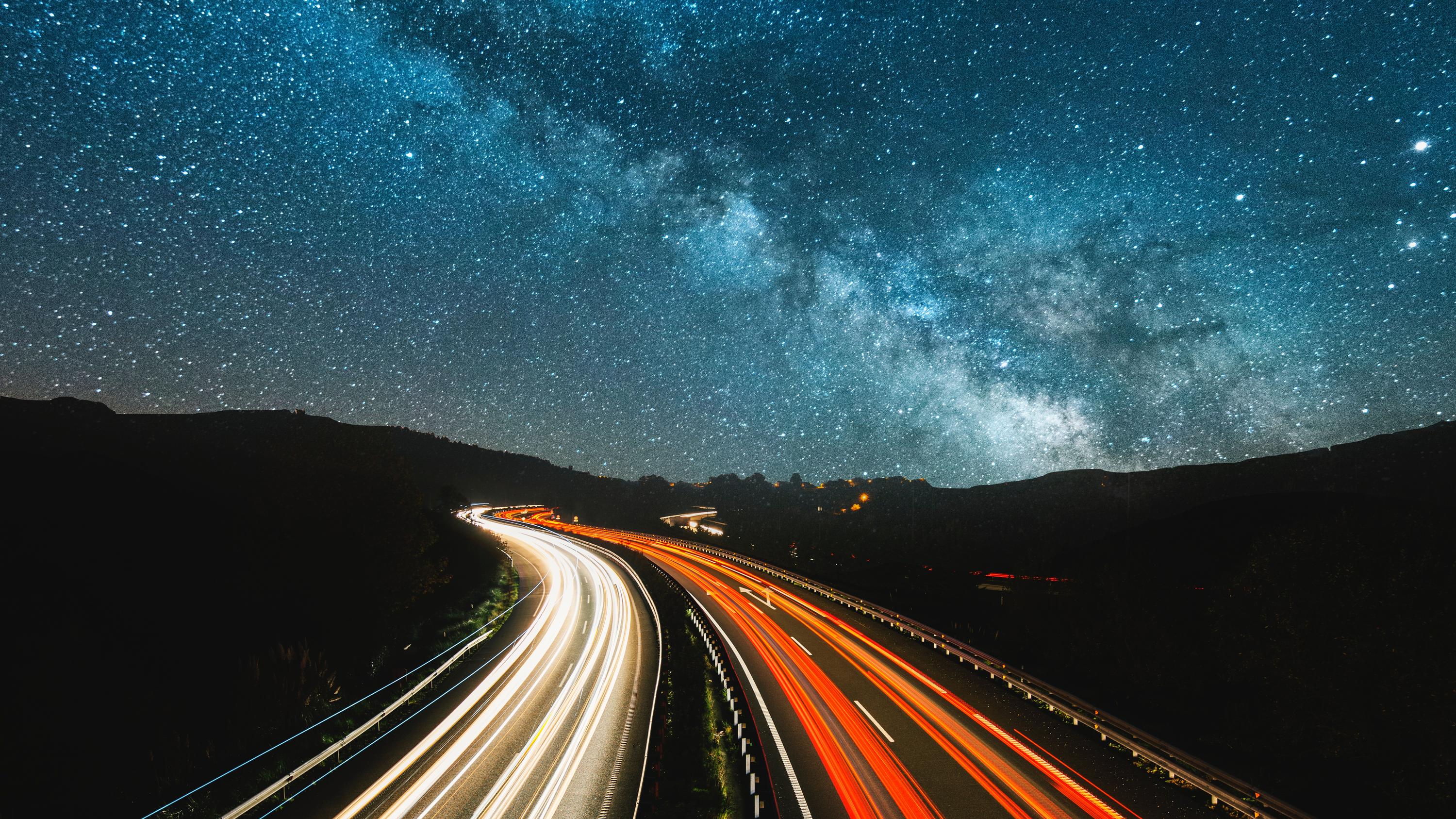 Blurred car headlights moving on a highway
