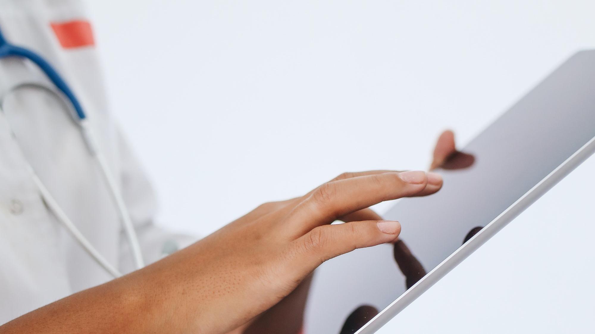 Healthcare working using her tablet